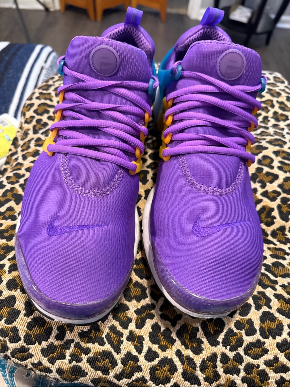 The shoes in the image are the Nike Air Presto ‘Wild Berry’